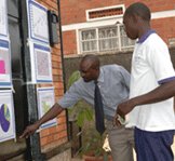 Health workers looking at HRIS data